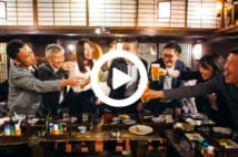 A group of Japanese people are having celebratory toast with beer in an Izakaya (Japanese style pub).